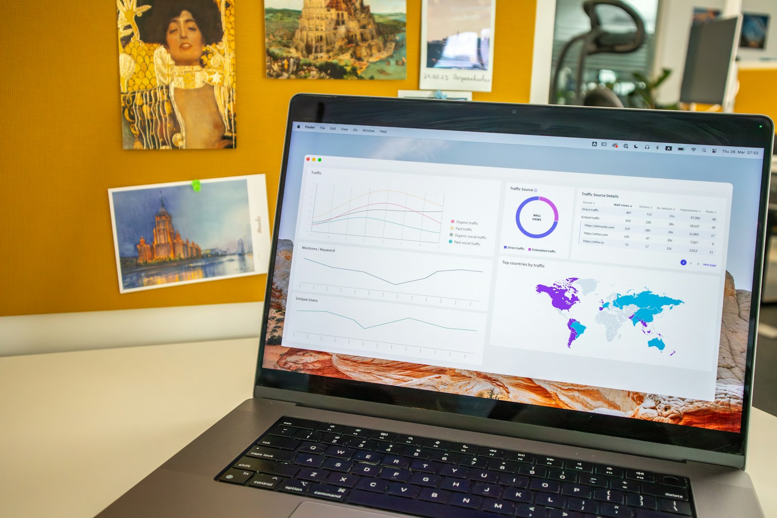 Social media analytics dashboard on a laptop in a creative workspace